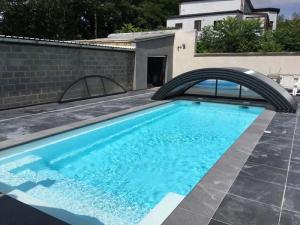 abri de piscine bas cintré belgique